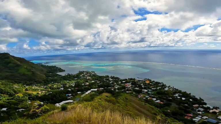 Moorea view of sea, clouds and town from above Mount Rotui