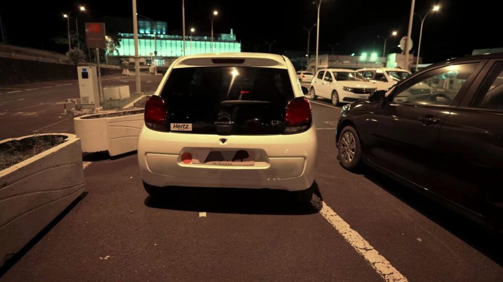 Hertz rental car at a parking lot in Tahiti