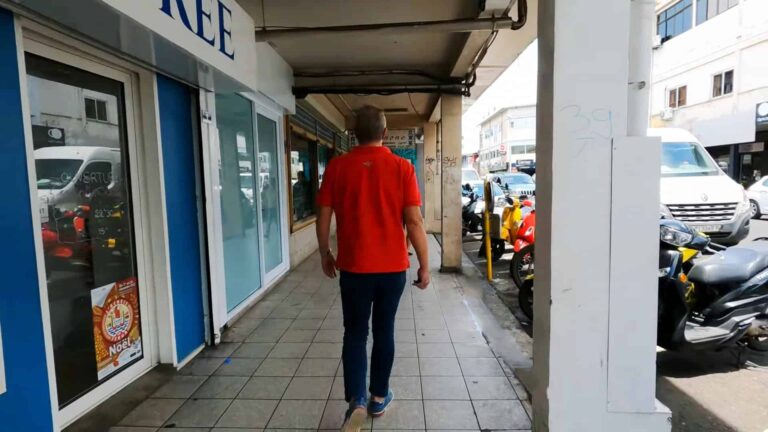 Man in red shirt walking in Papeete city